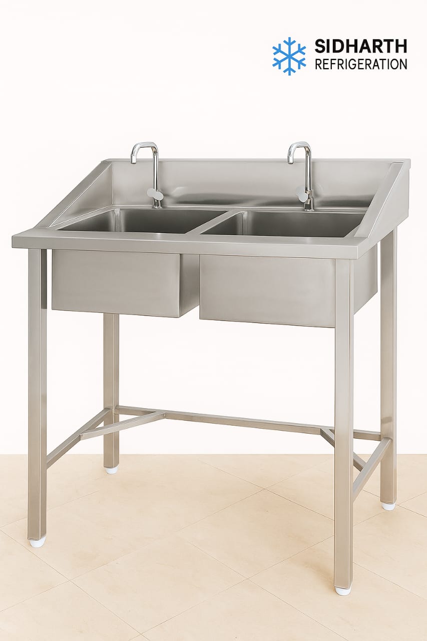 Buy 2 Box Sink with 2 Taps, Splash Guard & Pipe – Stainless Steel for Hotels Double stainless steel sink with 2 taps, side splash-proof panel, and drain pipe + coupling included. Perfect for commercial kitchens, hotels, and caterers. Free delivery & setup support.
